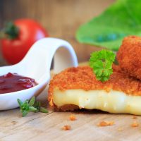 Rustic table setting with rosemary on light wooden table. Holidays decoration on Provence style. Romantic dinner. Flat lay